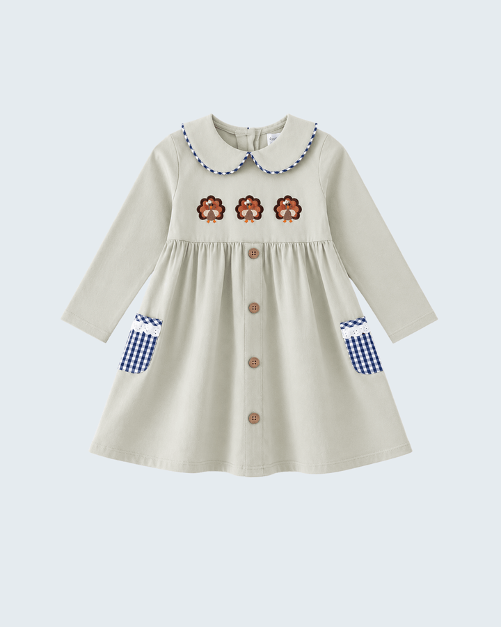 Sage long-sleeve dress with blue Peter Pan collar, orange embroidery, and blue gingham cuffs
