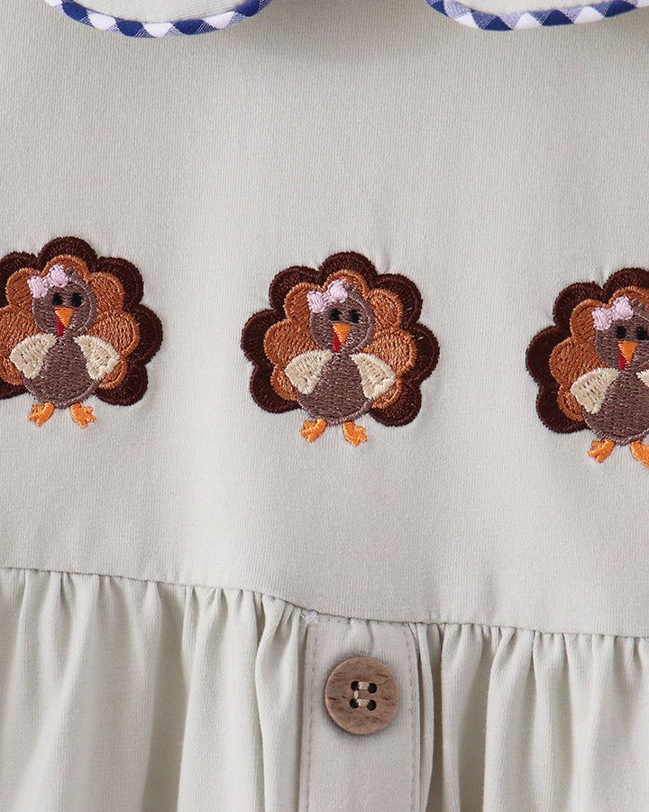 Sage dress bodice with embroidered turkey motifs, round button front, gathered skirt
