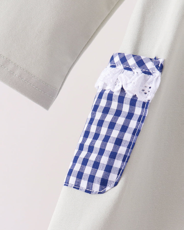 Sage dress sleeve with blue and white gingham cuff detail