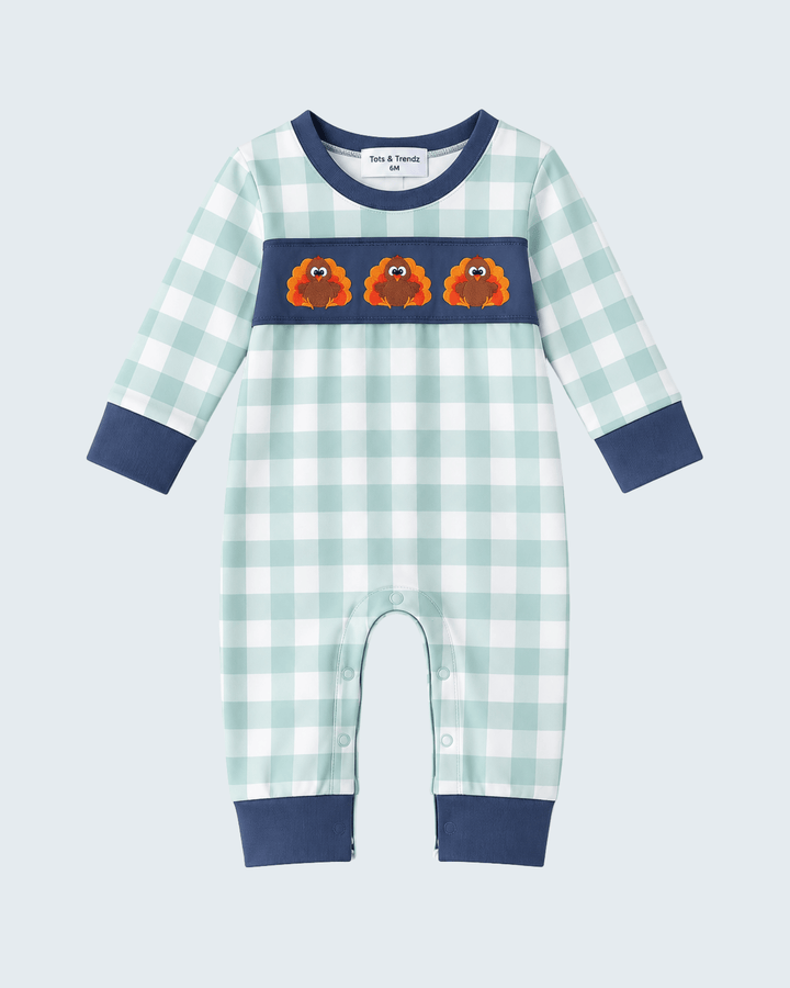 Mint gingham baby romper with navy yoke, embroidered turkeys, and snap front legs