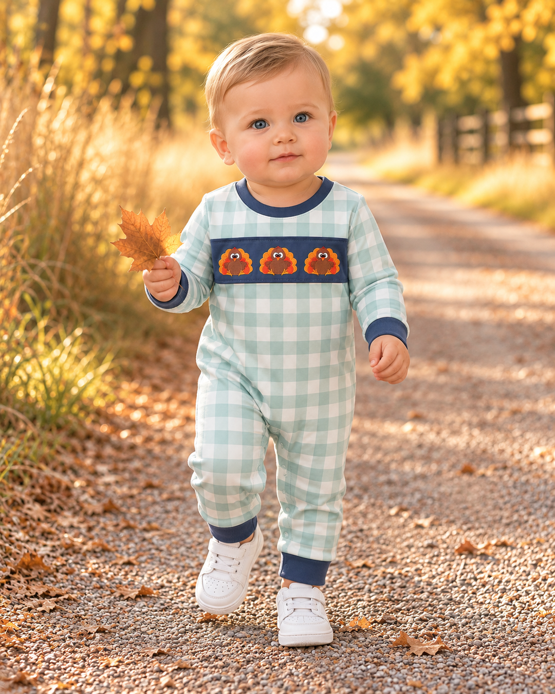 Mint and white gingham baby romper with navy cuffs and embroidered turkey faces