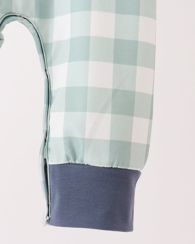 Mint gingham baby romper leg opening with navy knit cuff