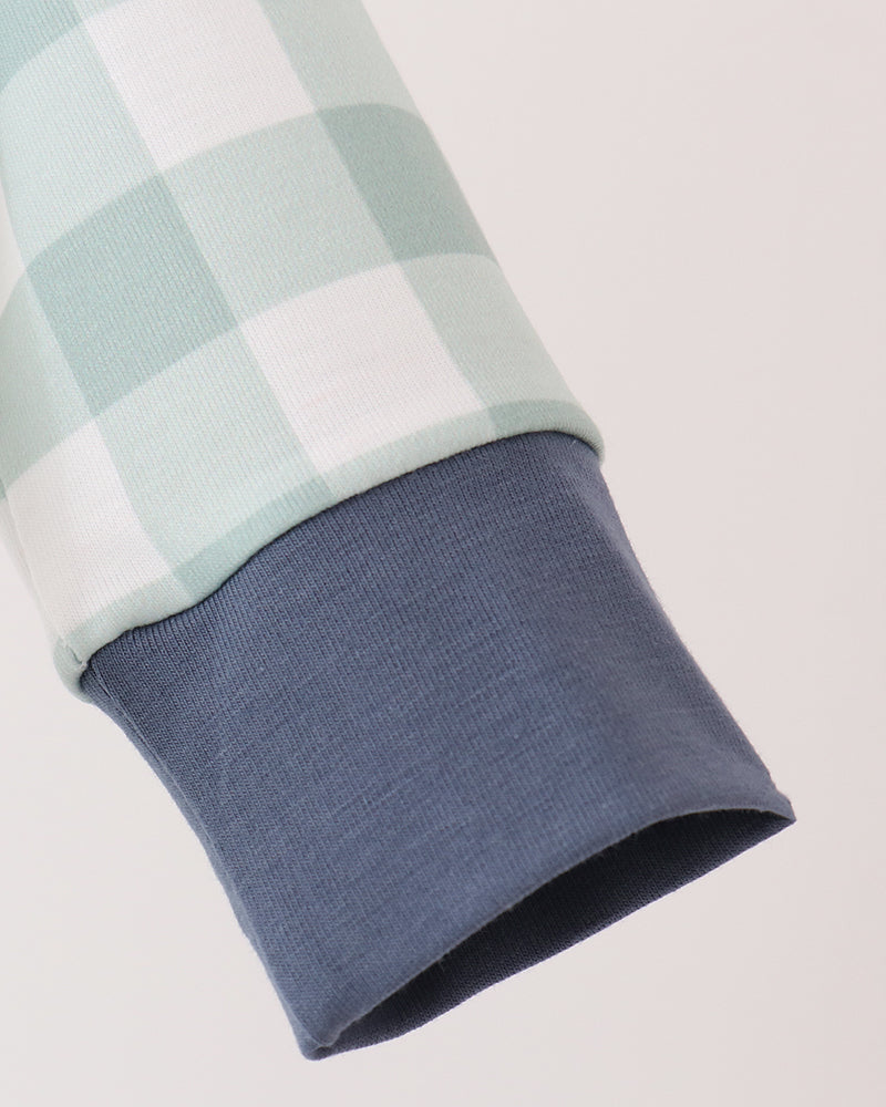 Mint gingham sleeve with navy knit cuff
