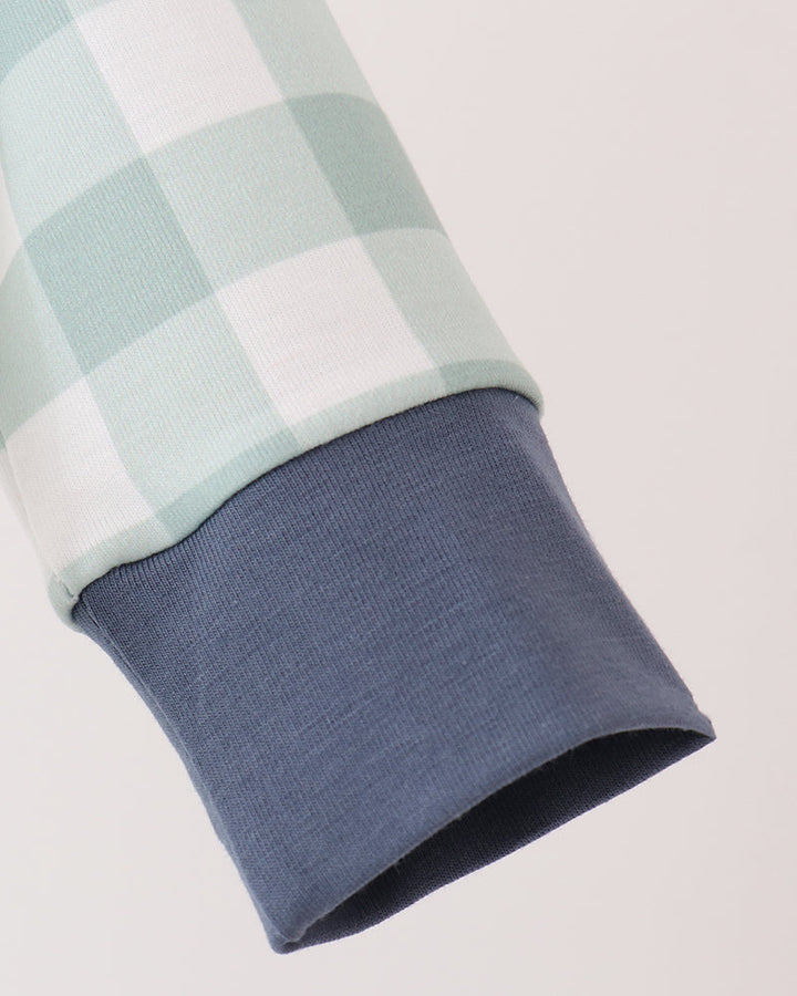 Mint gingham sleeve with navy knit cuff