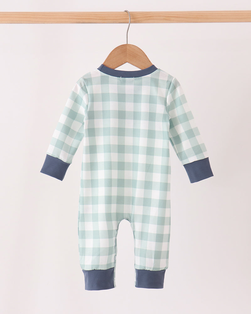 Mint and white gingham baby romper with navy long-sleeve cuffs, hanging
