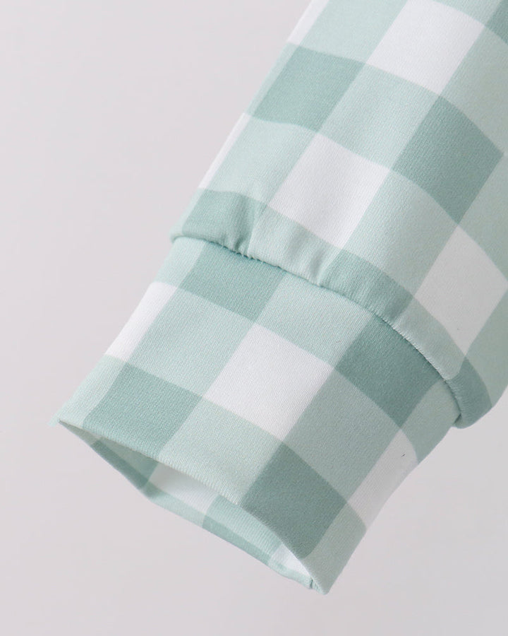 Mint and white gingham fabric cuff detail on the jogger set sleeve