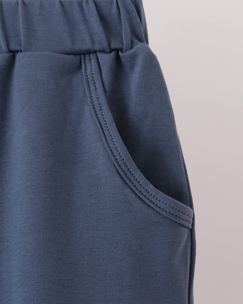 Dark navy jogger waistband with stitched seam and inner drawstring