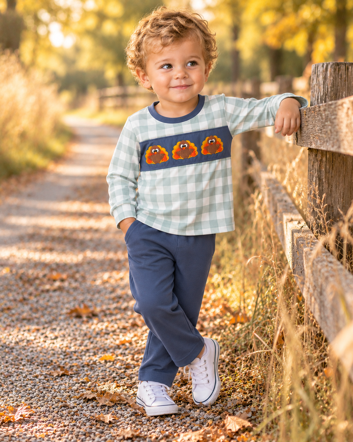 Toddler boy is wearing a Sage Turkey Embroidered Gingham Pants Set