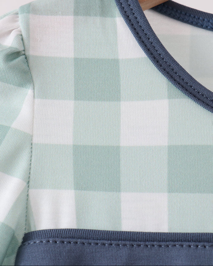 Gingham dress neckline with navy binding and crew collar