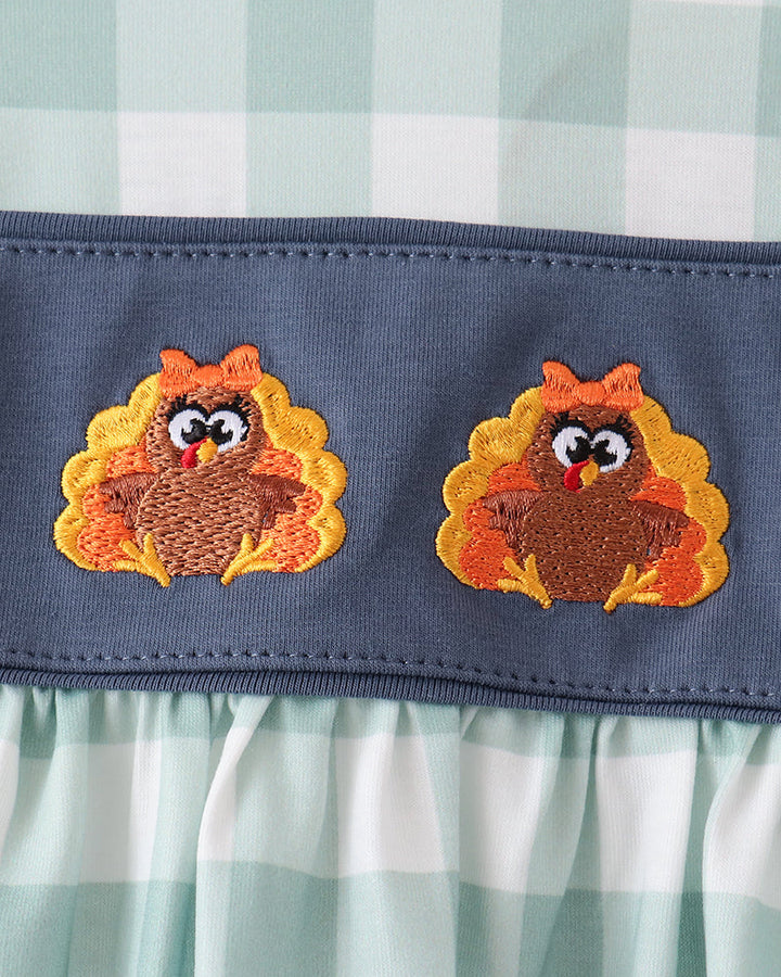 Navy dress yoke with three turkey appliques and orange embroidered details
