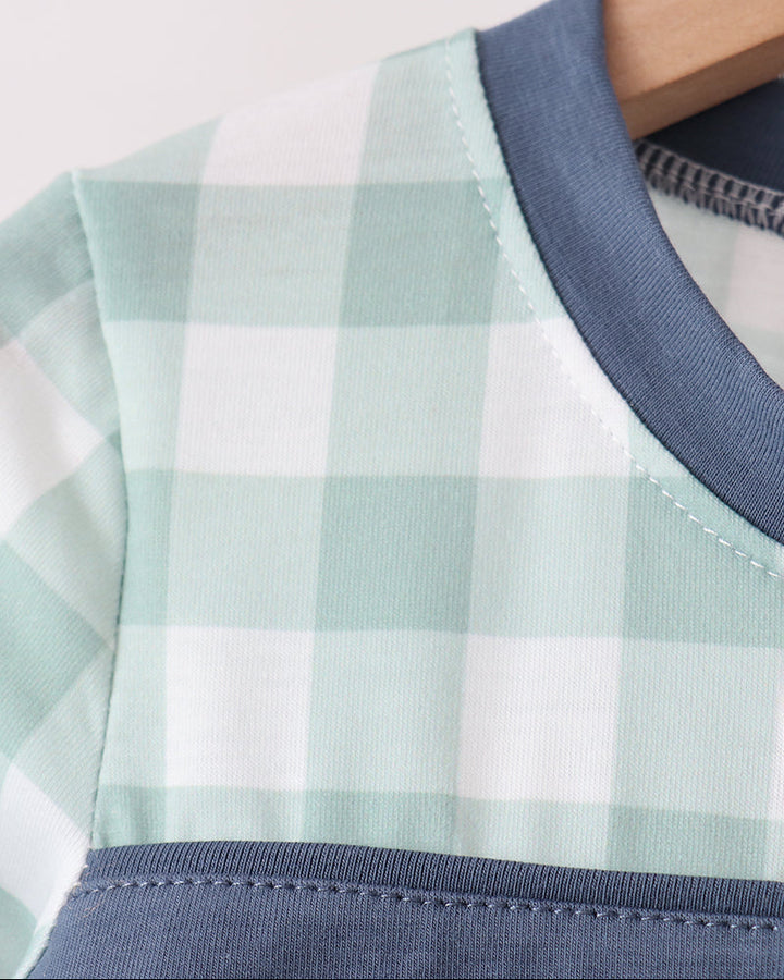Gingham long-sleeve top neckline with navy crew collar and stitched edge