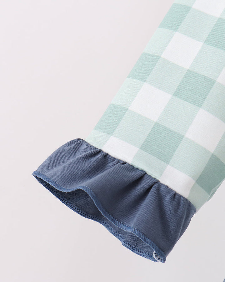 Gingham sleeve cuff with navy ruffle hem detail