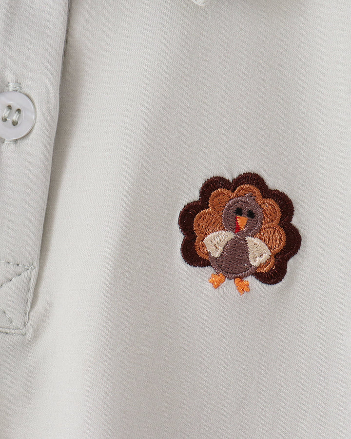 Light sage polo shirt with embroidered turkey chest applique