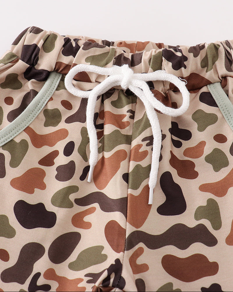 Camouflage-patterned pants with a white drawstring on a white background