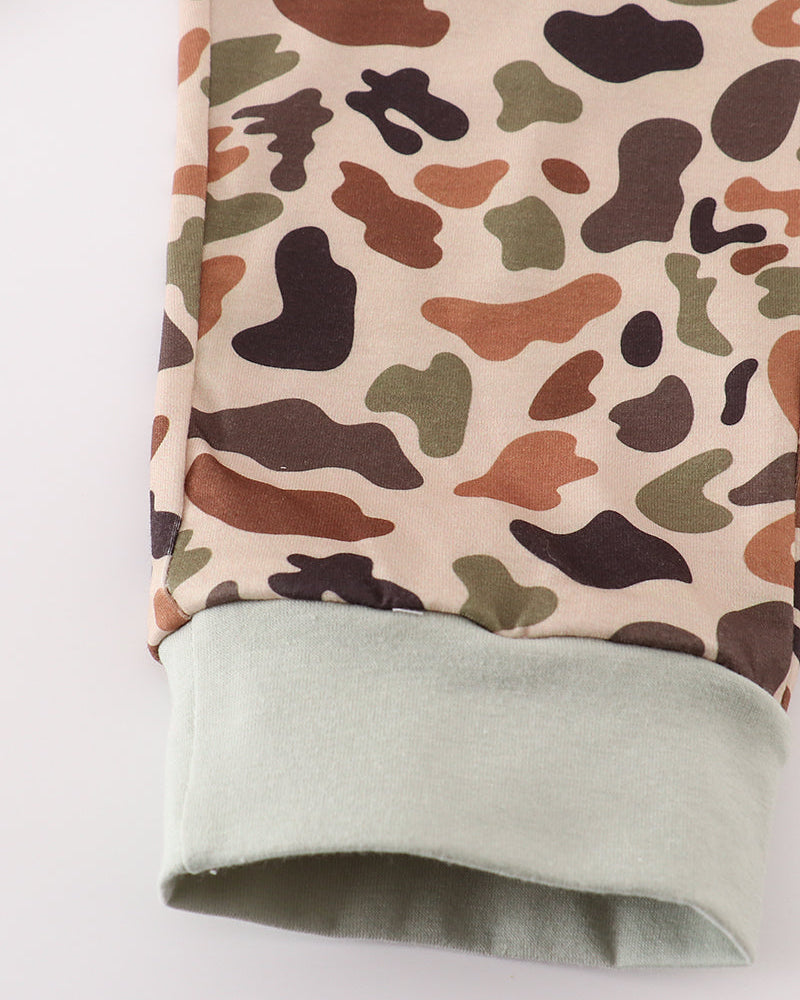 Fabric with a camouflage pattern on a beige background