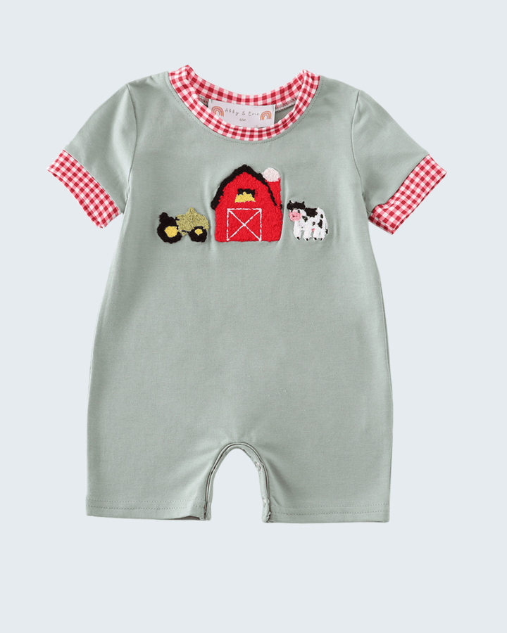 Sage green farm embroidered baby romper on light grey background