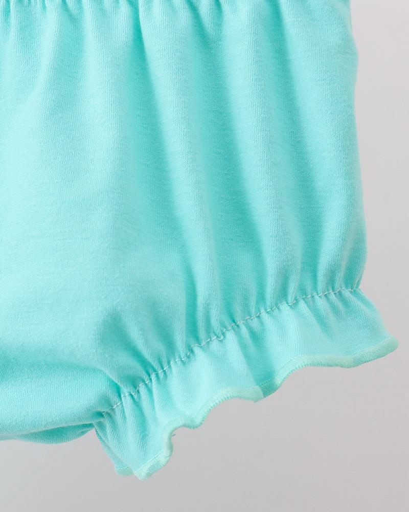Close-up of light blue shorts on a plain background