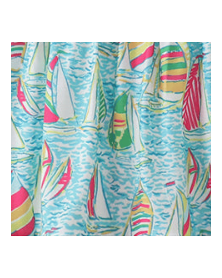 Colorful sailboat pattern on a blue background