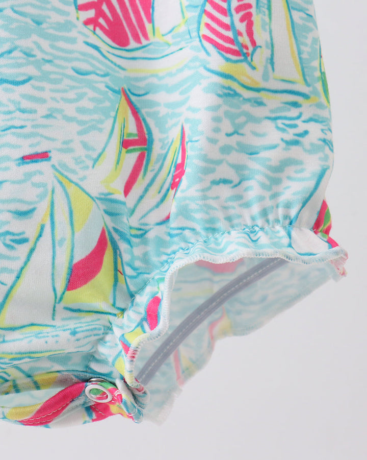 Colorful swimsuit with sailboat pattern on a white background