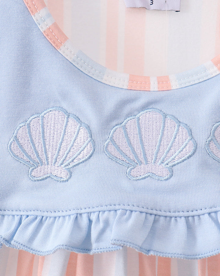 Light blue yoke with embroidered seashells and ruffled hem on a sleeveless dress