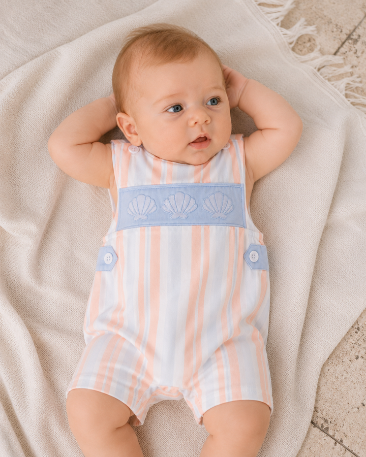 Sleeveless striped jon jon romper on baby, shell embroidery with blue bib panel