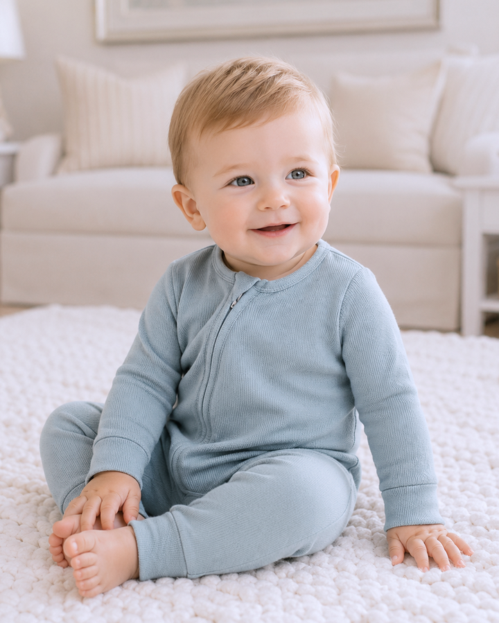 Blue cotton baby zipper romper with long sleeves and convertible cuffs