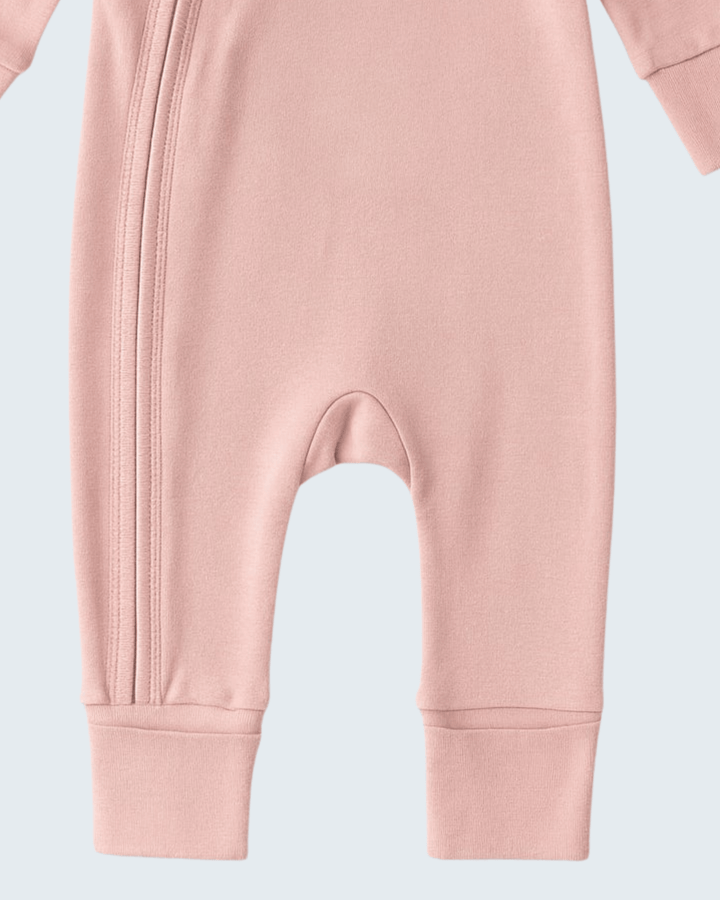 Soft coral cotton romper with zip placket and sleeved legs, open crotch