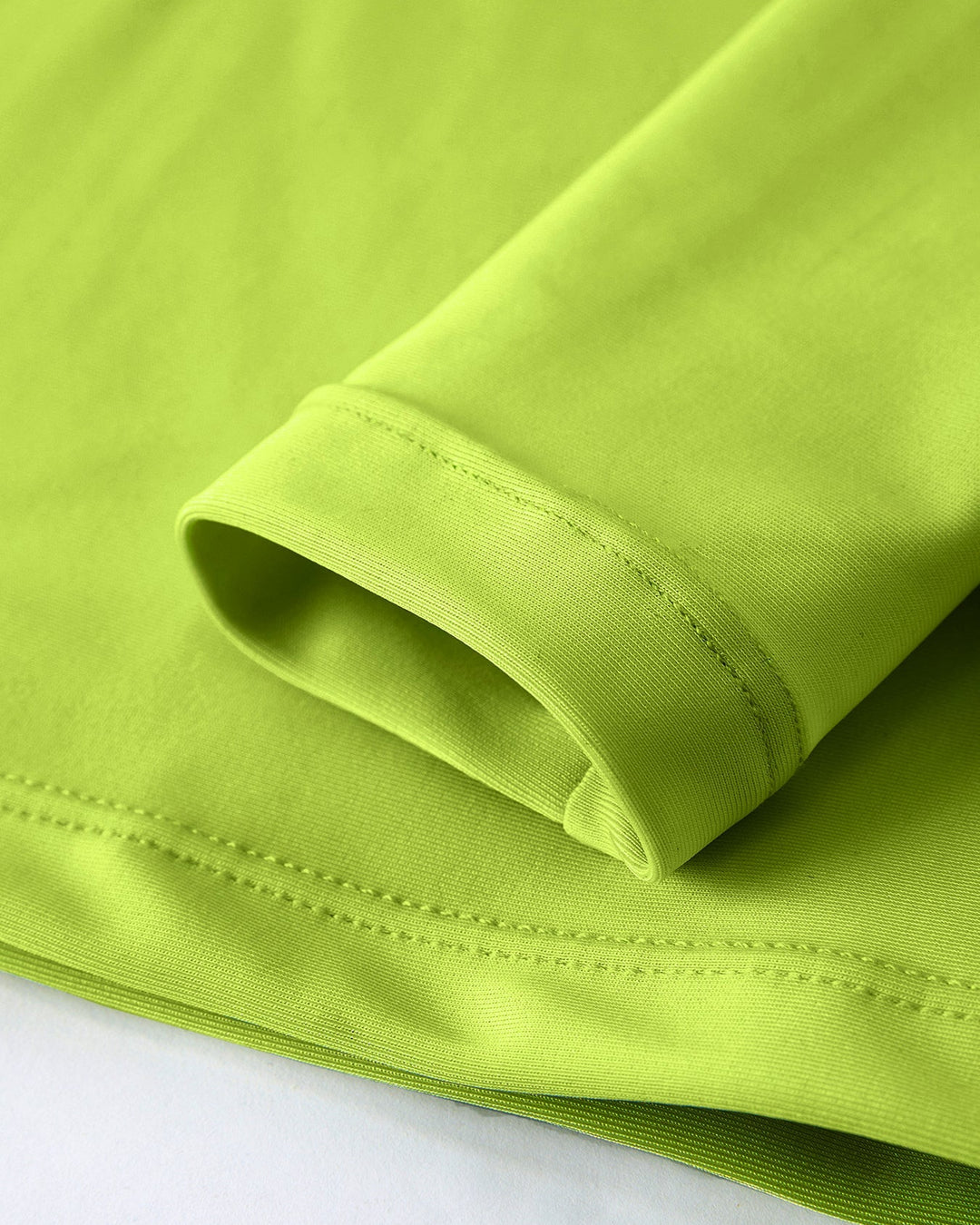 Close-up of a green fabric with a white background