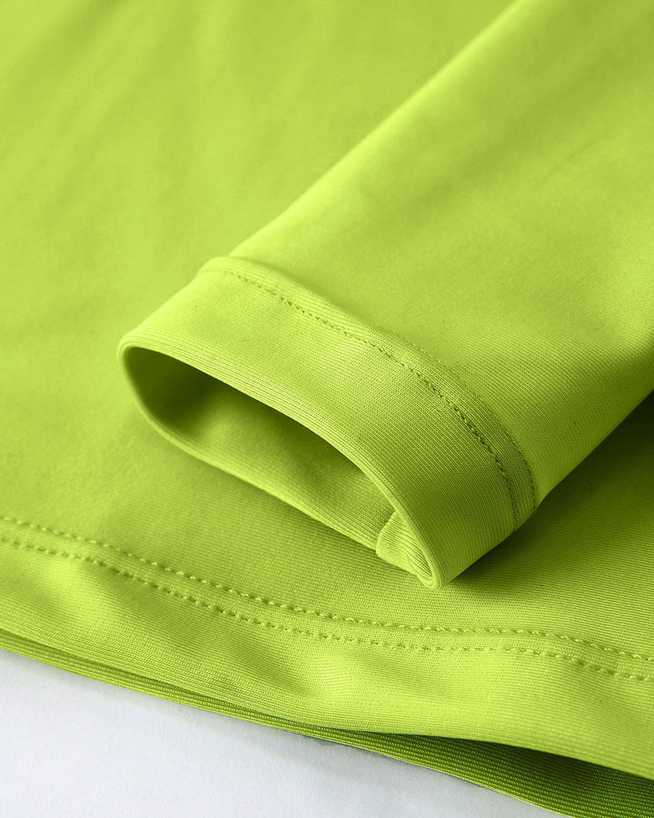 Close-up of a green fabric with a white background