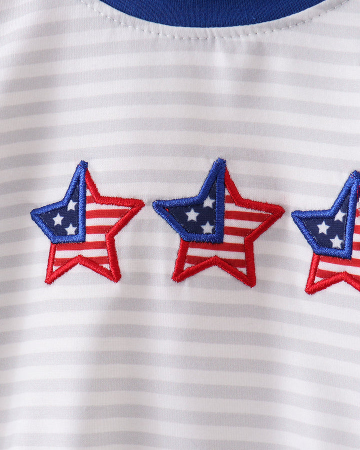 Close-up of a white shirt with red, white, and blue stars.