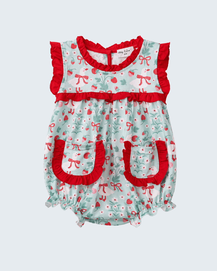 Baby romper with red and white pattern on a light gray background