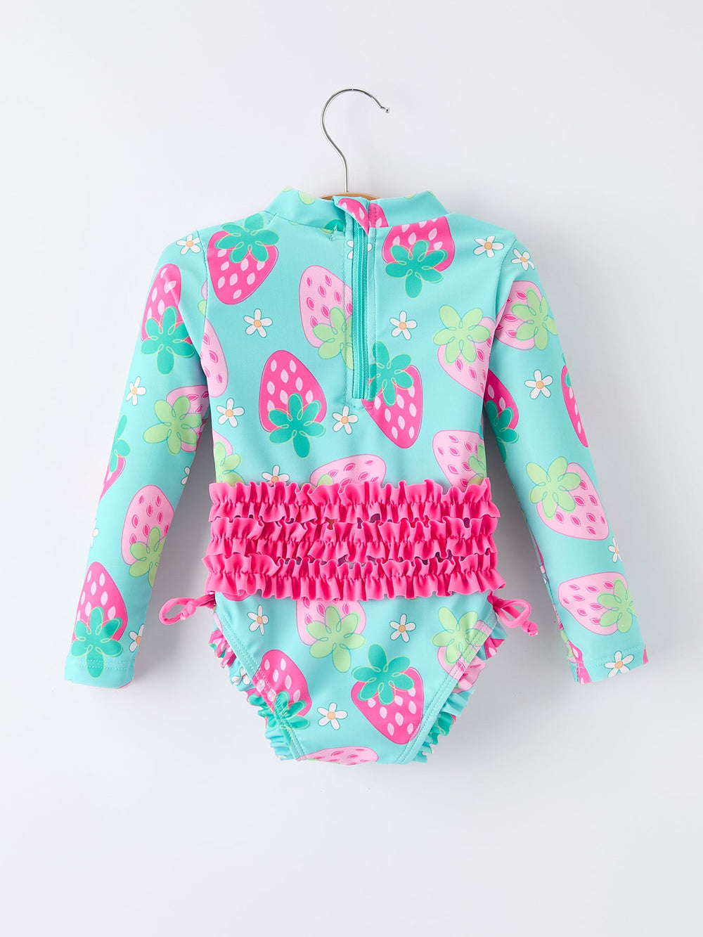 Children's swimsuit with strawberry pattern on a white background