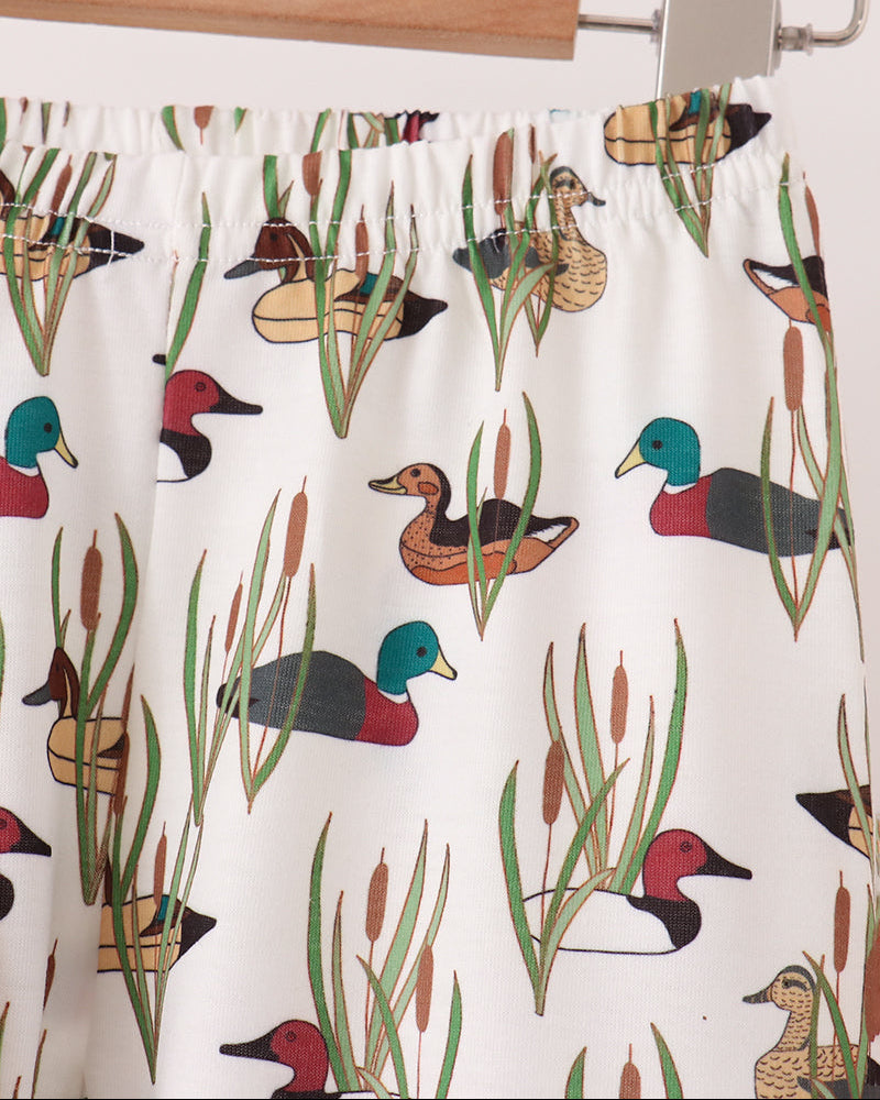 Tan pajama pants with allover duck and plant print, elastic waistband