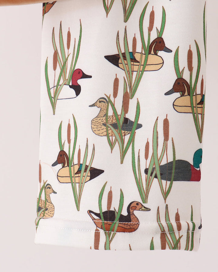 Tan pajama pants with allover duck and plant print, embroidered hem details