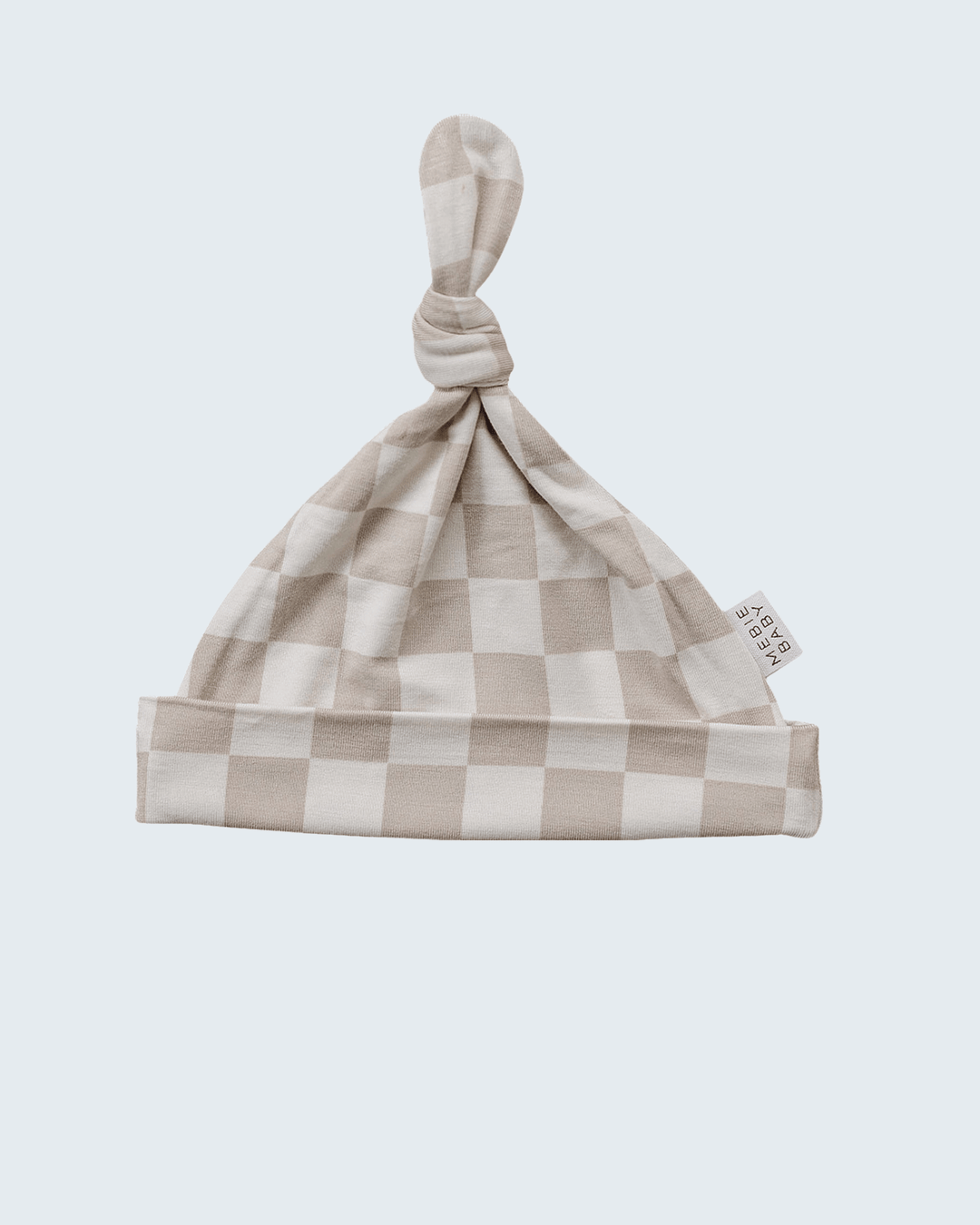 Checkered baby hat on a light gray background