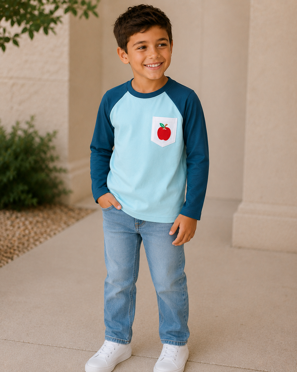 Young boy standing outside looking to the side
