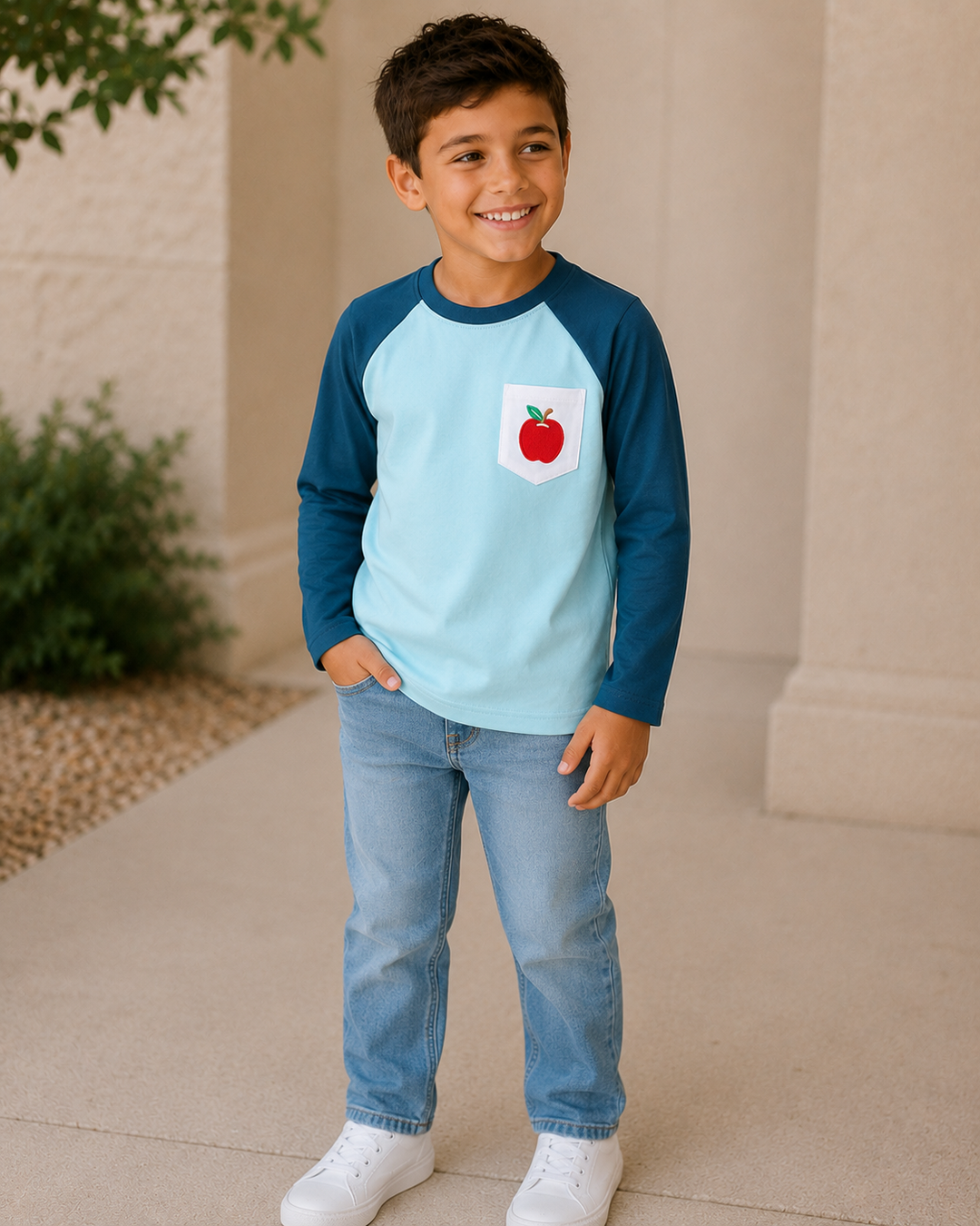 Young boy standing outside looking to the side