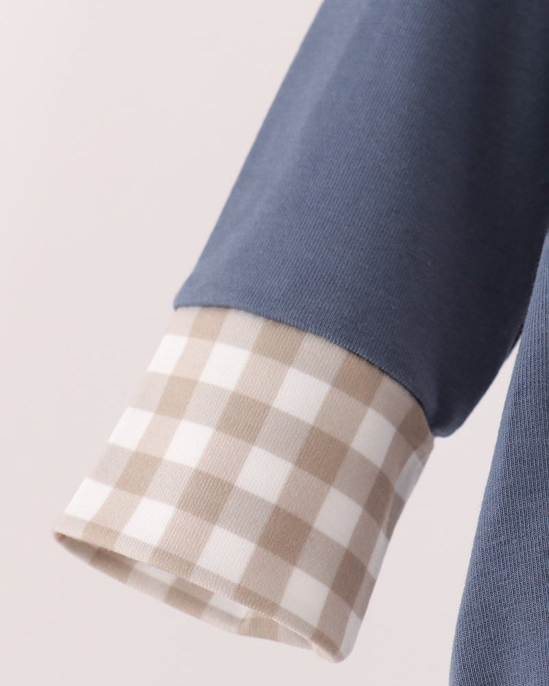 Blue long-sleeve romper sleeve with beige and brown gingham cuff