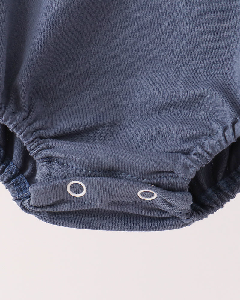 Blue cotton romper bottom with snap closure at leg opening