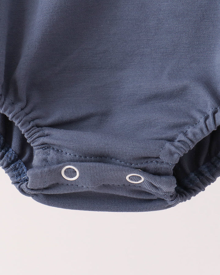 Blue cotton romper bottom with snap closure at leg opening