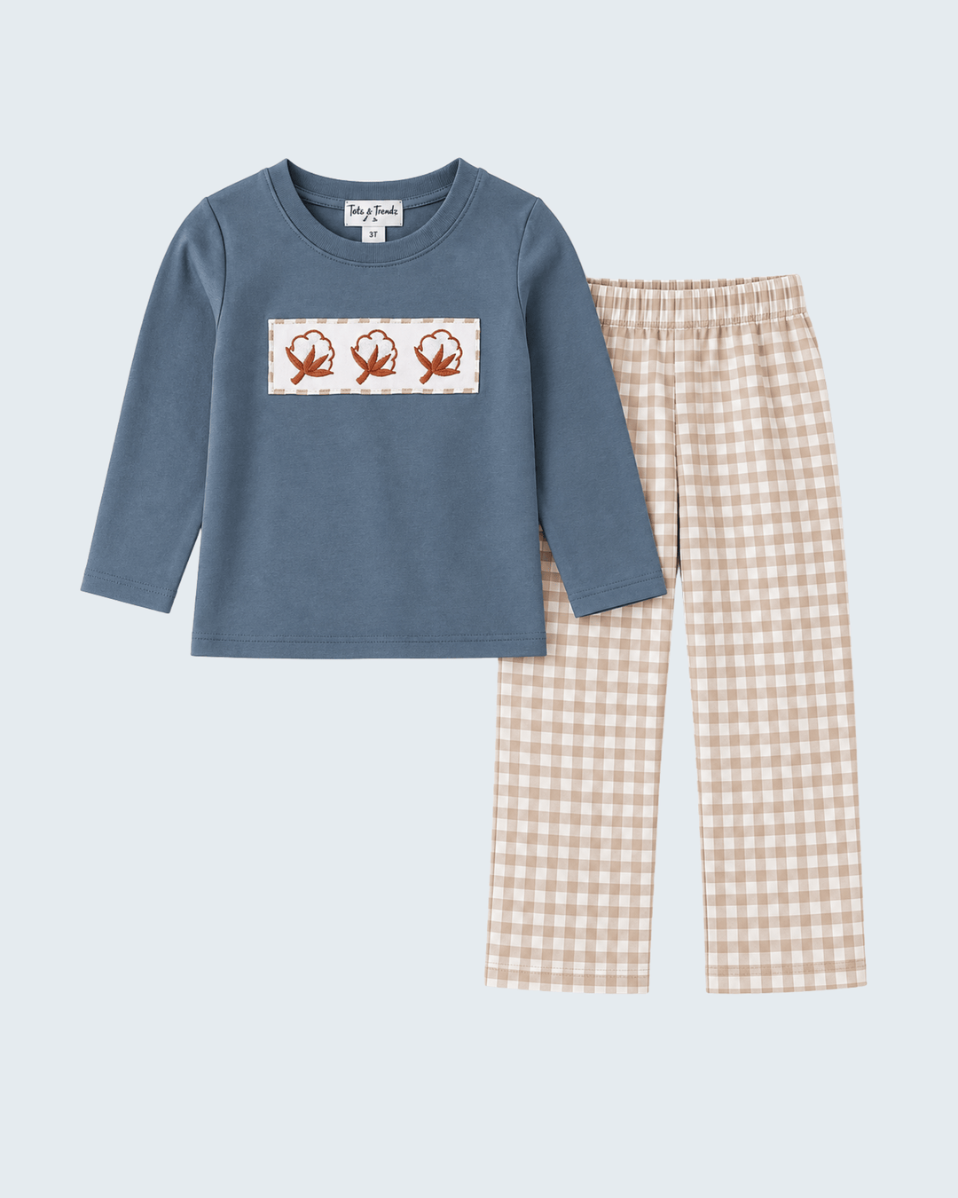 Teal long-sleeve top with embroidered panel and cream gingham pants