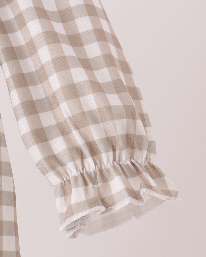 Gingham baby romper sleeve with gathered cuff and white ruffle hem