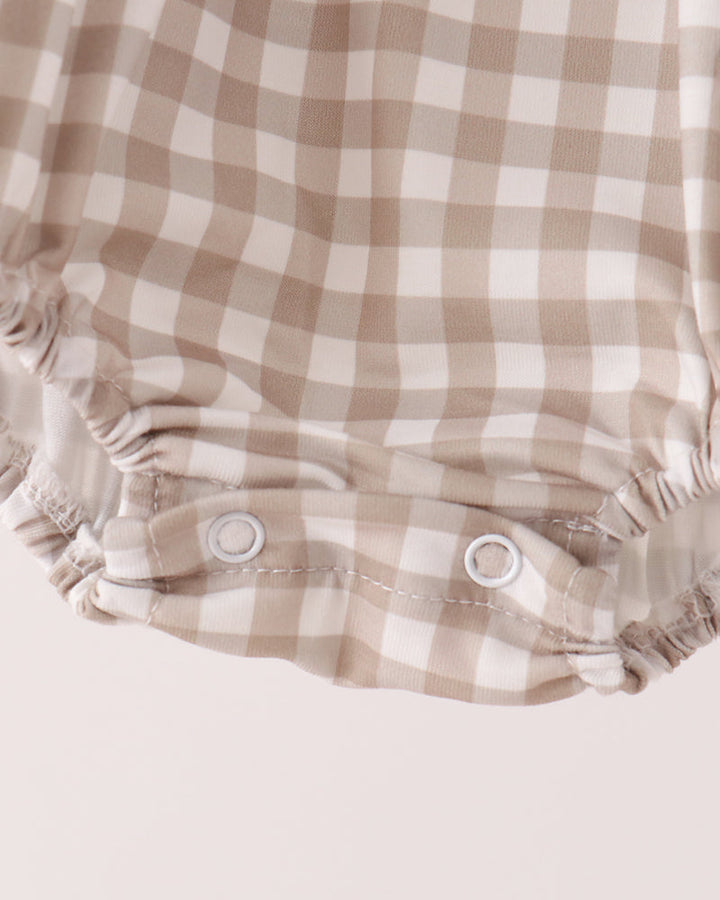 Gingham baby romper bottom with elastic leg openings and button placket