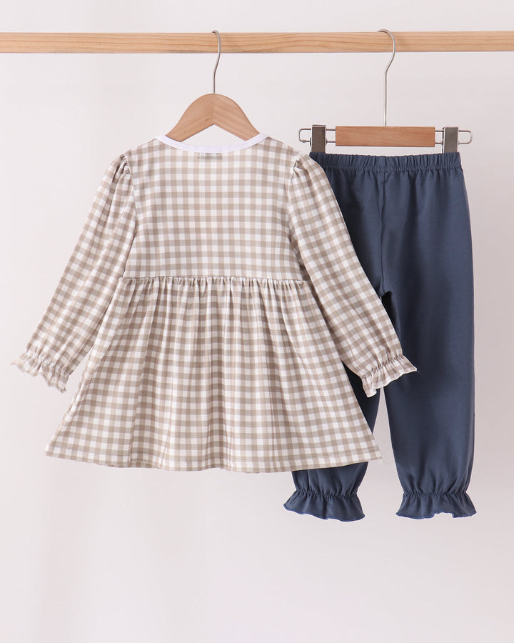 Kids gingham ruffle top and dark teal pull-on pants set on hangers