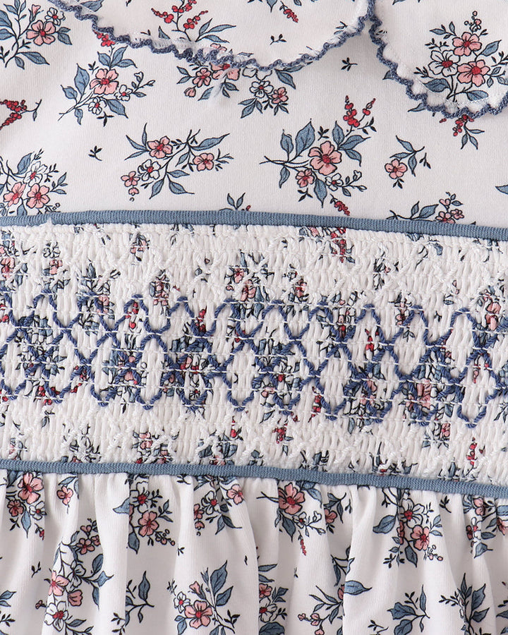 Floral smocked bodice with gathered skirt detail on white base