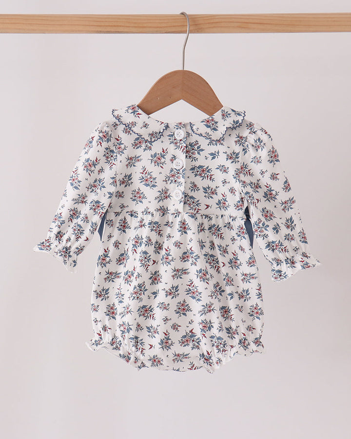 Floral smocked bubble dress with long sleeves and bow, white with blue and red flowers