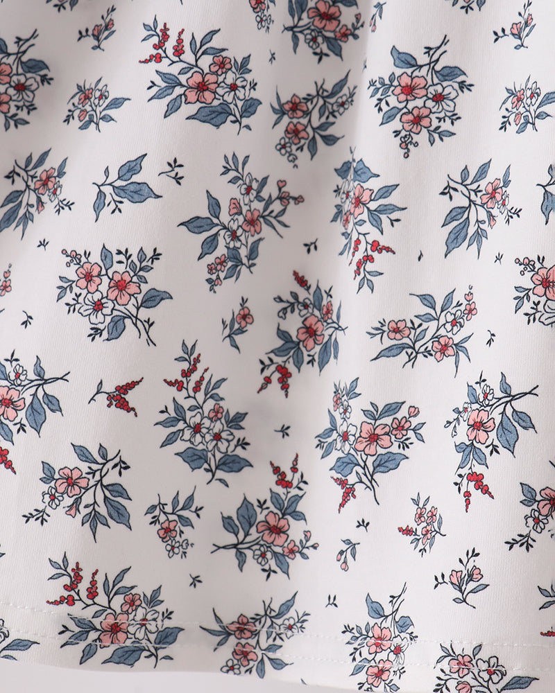 Blue floral pattern skirt of a smocked bow dress