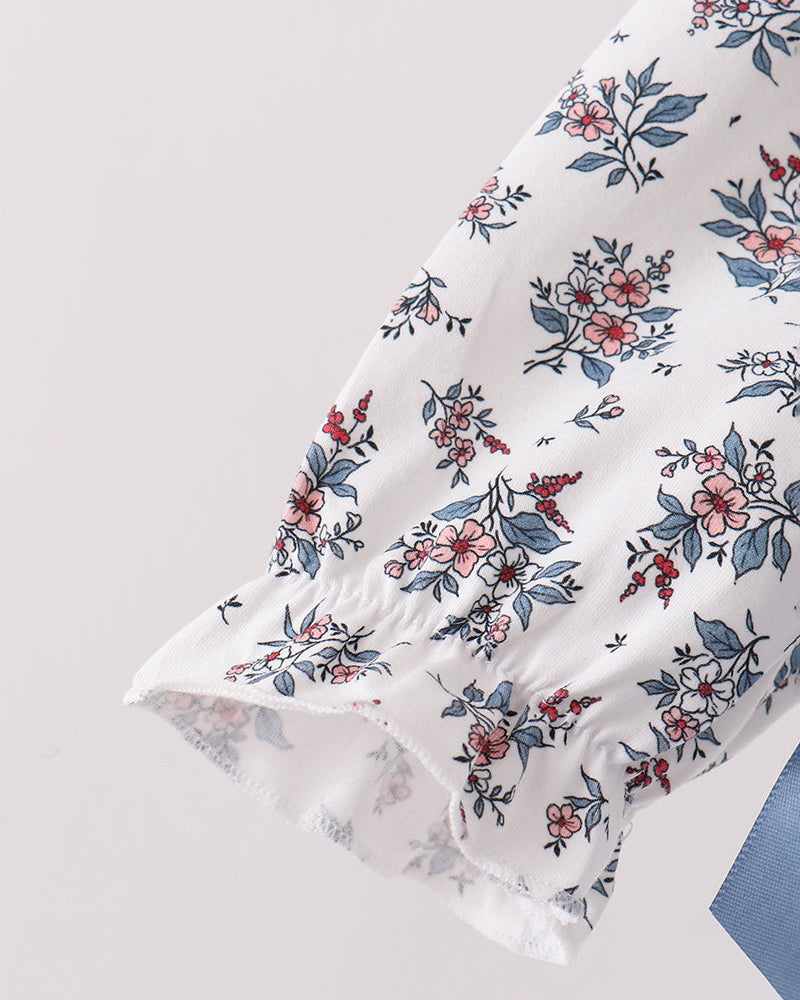 Blue floral dress sleeve with ruffled cuff and long gathered skirt