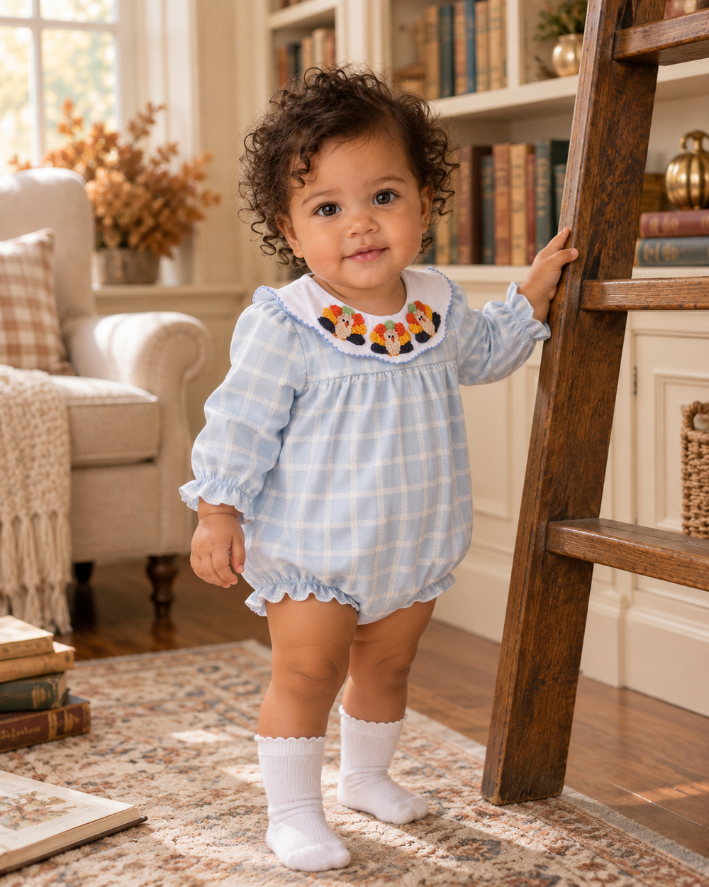 Teal plaid baby bubble with white collar and colorful embroidered trim
