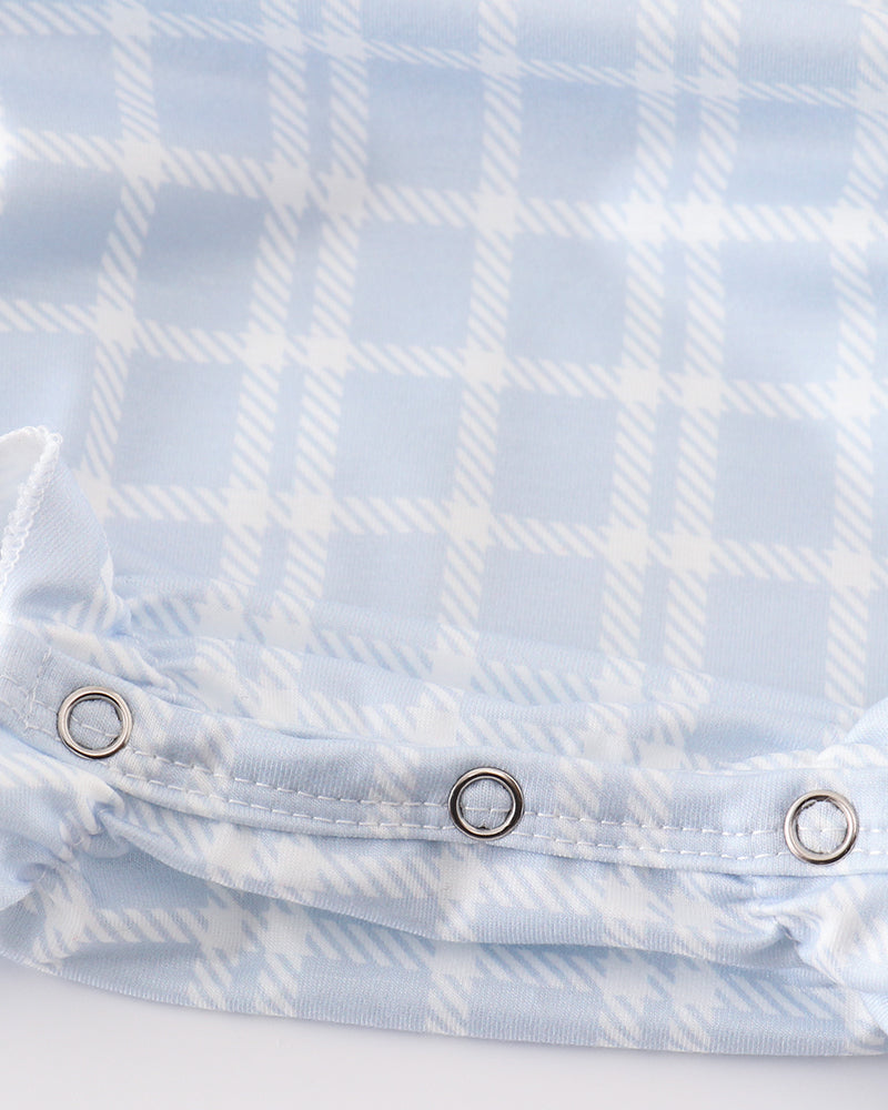 Light blue plaid girl bubble romper with snap buttons at front waist